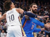 Oklahoma City Thunder center Steven Adams (12) looks to pass around New Orleans Pelicans center Jaxson Hayes (10) during the first half of an NBA basketball game Friday, Nov. 29, 2019, in Oklahoma City. (AP Photo/Sue Ogrocki)